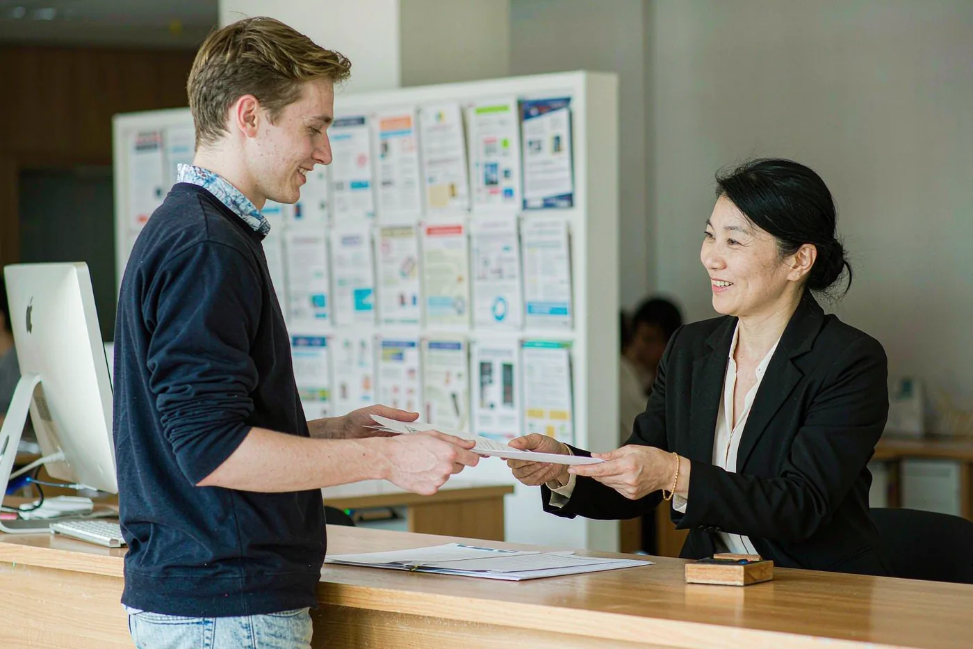 An international student registering at a university international office in China