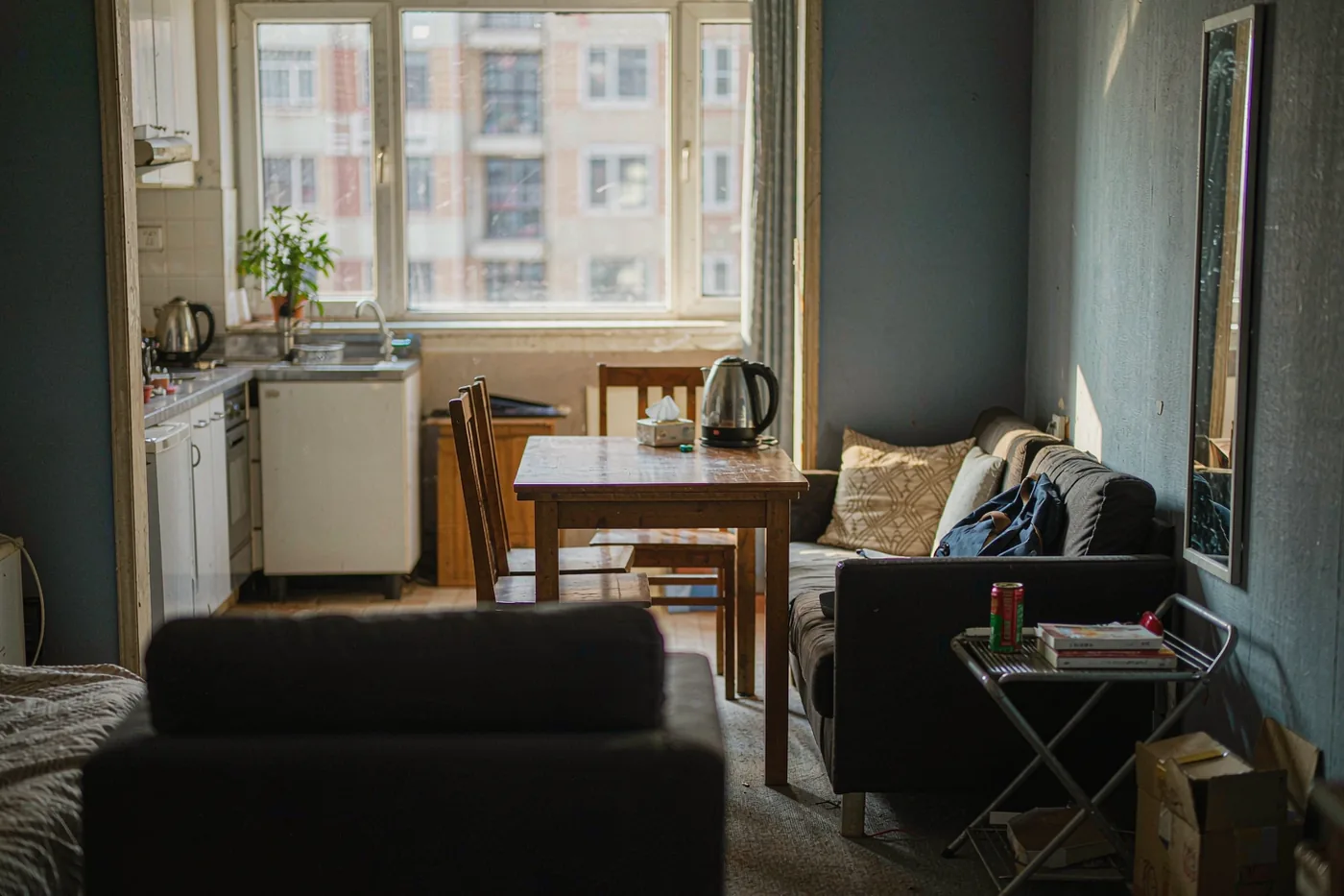 Interior of a furnished off-campus rental apartment in China with a kitchenette and dining area
