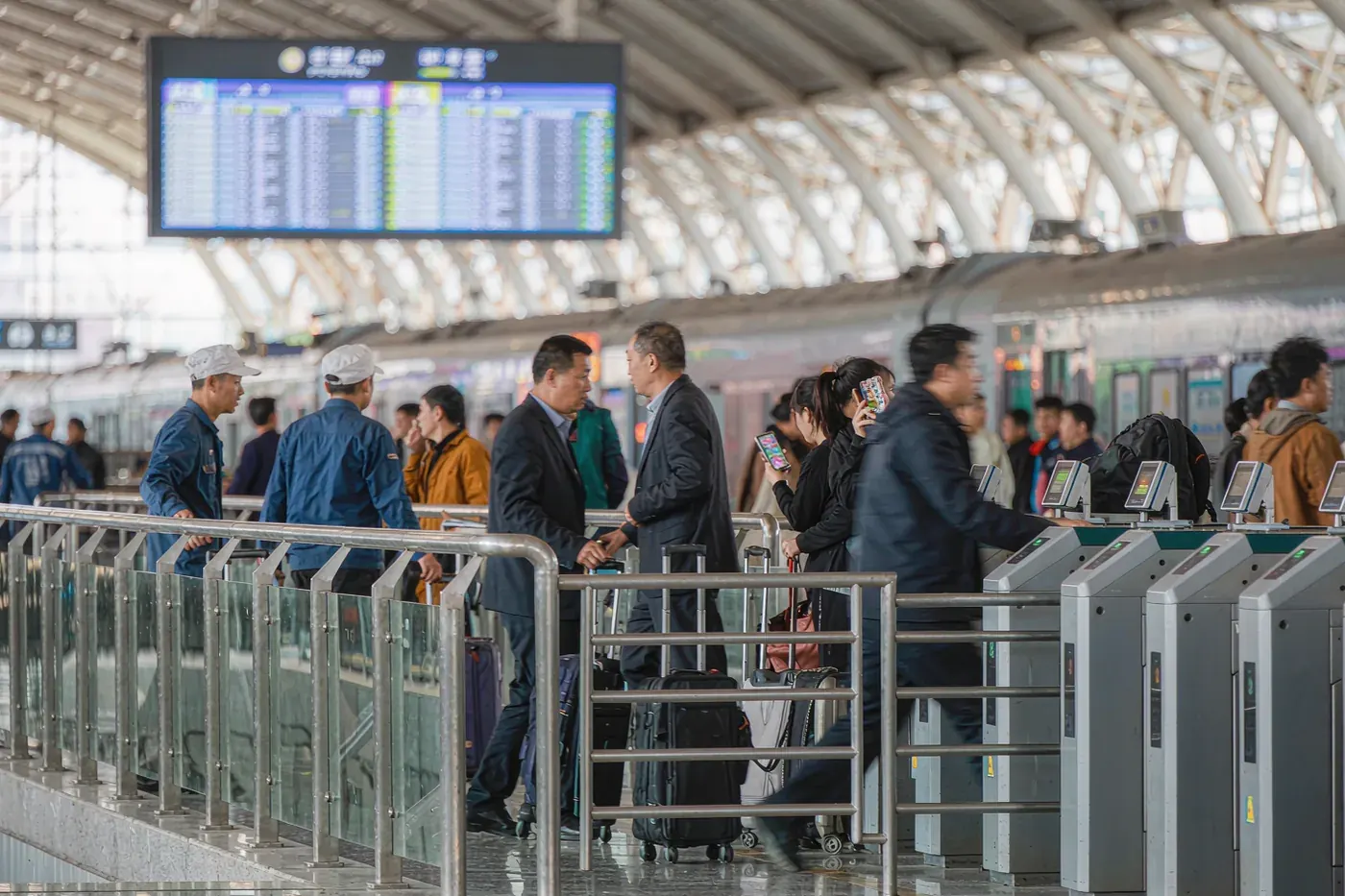 Passengers queueing at the boarding gate of a Chinese high-speed rail station
