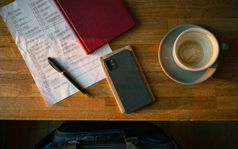 First month in China checklist with documents and a packed suitcase