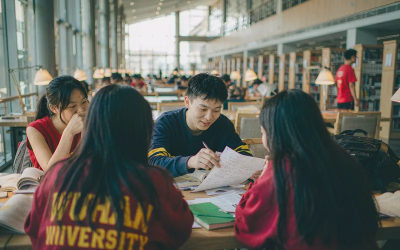 International students studying together in a Chinese university library